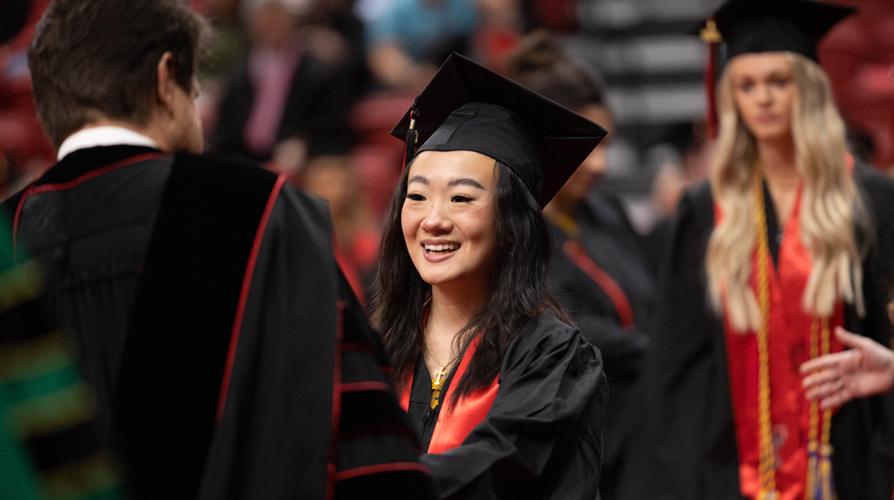 a student receiving diploma from president